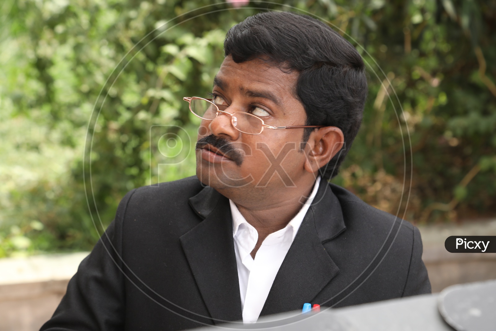 An Actor In Lawyer Getup At a Movie Shooting