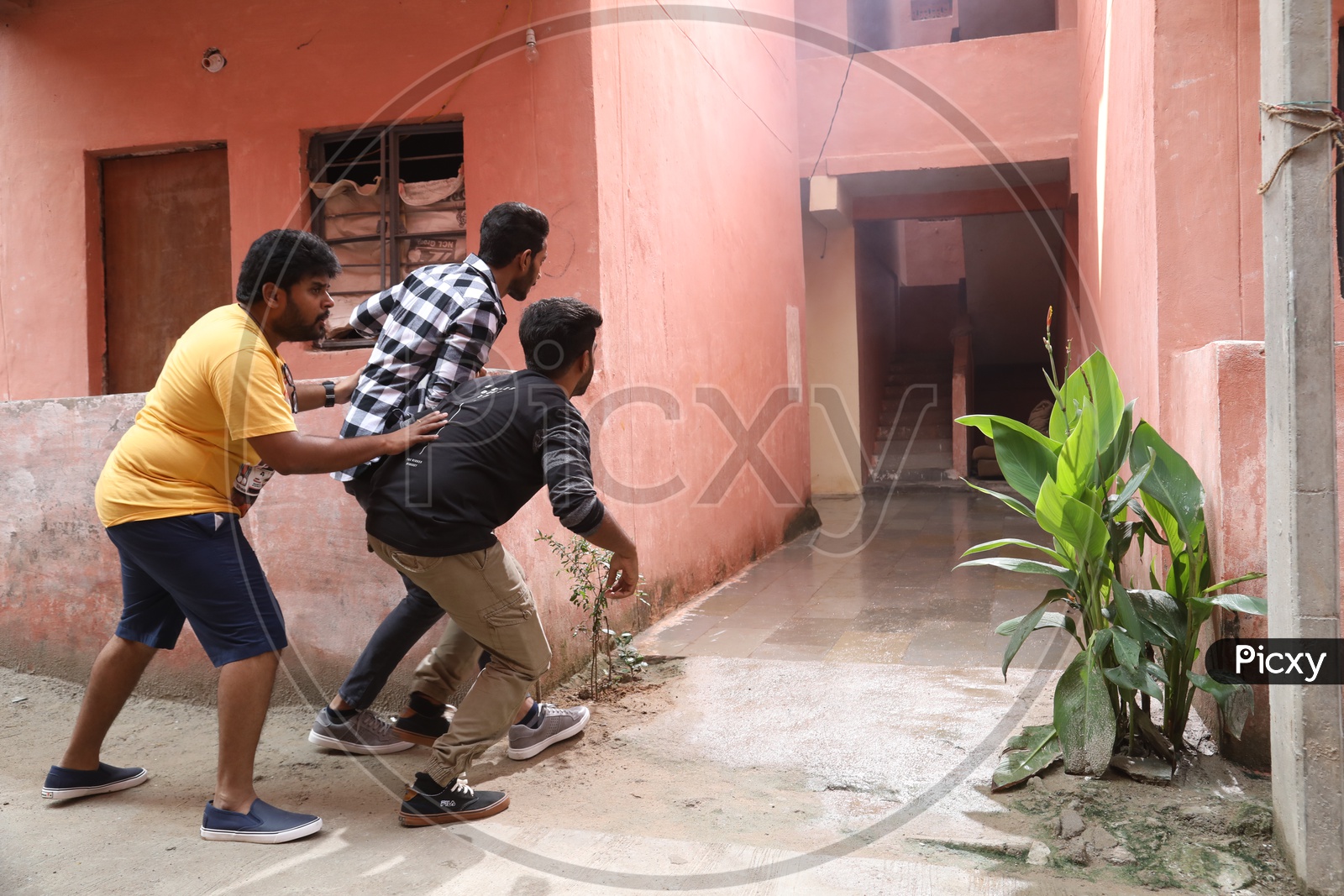 Indian Young Man Teasing a Girl By Hiding And Looking Secretly At a Residential Apartment