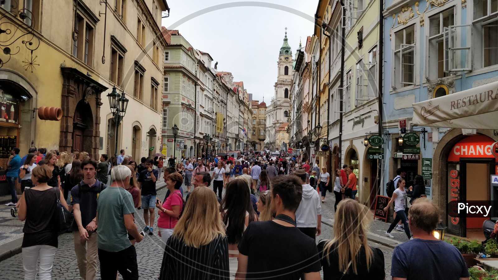 Streets Of Prague City With Tourists