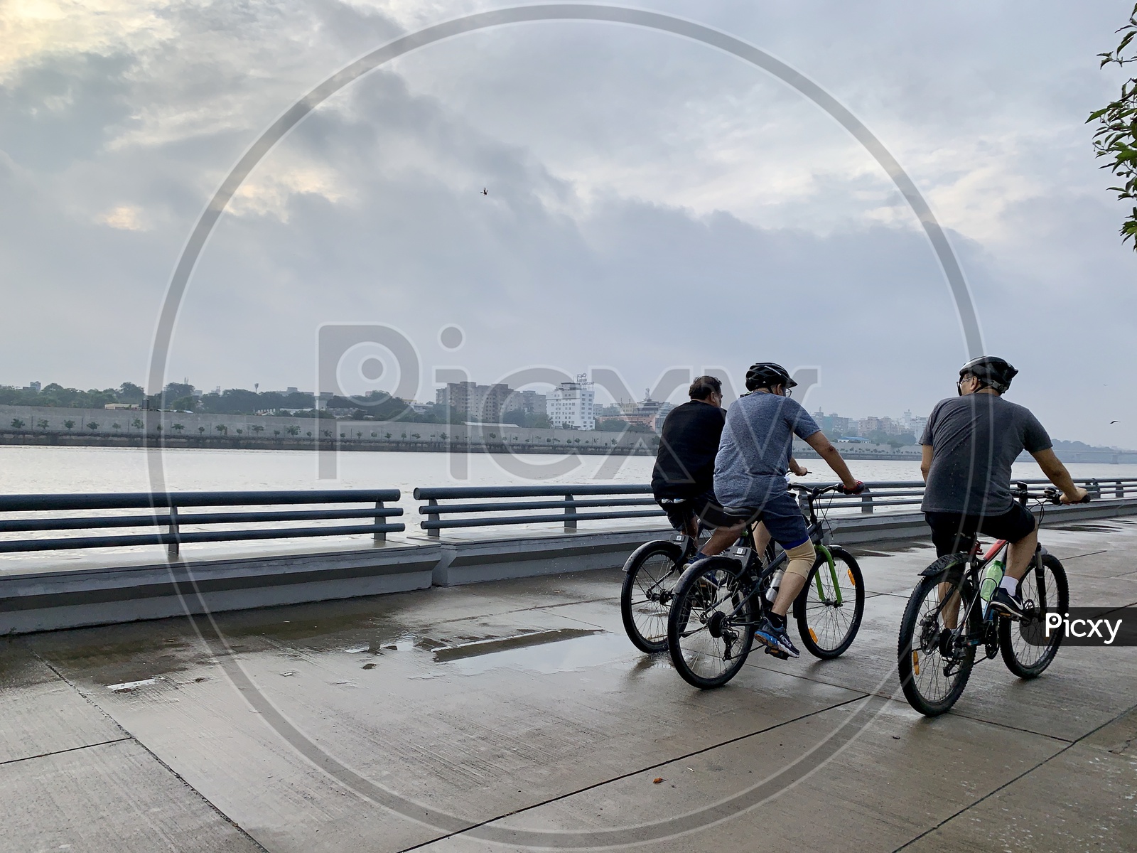 group of cyclist,cycling near riverside