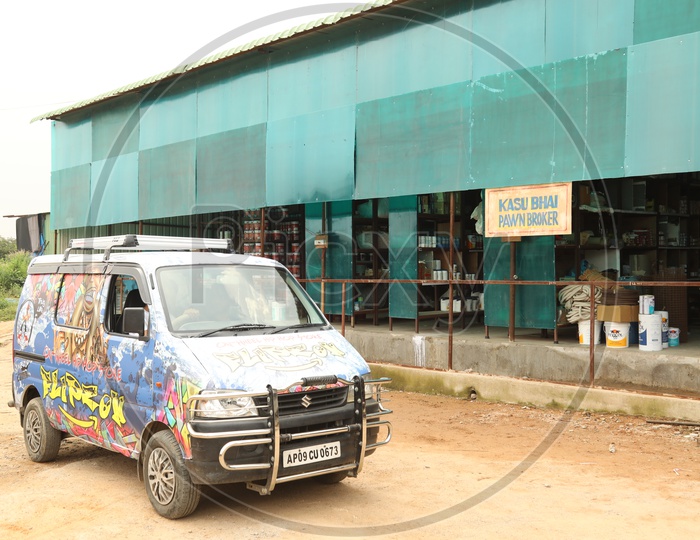 A Van With design On It At a Warehouse
