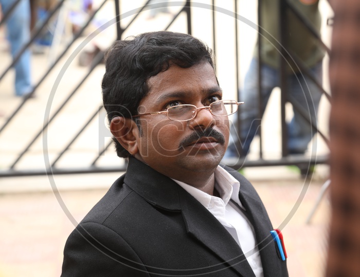 An Actor In Lawyer Getup At a Movie Shooting