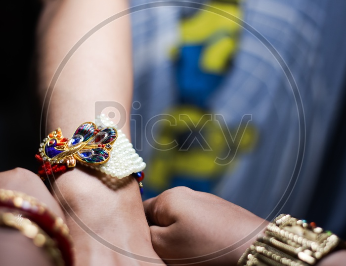 Sister Tying Rakhi To a brother Hand  During Traditional  Hindu Festival Raksha Bandhan