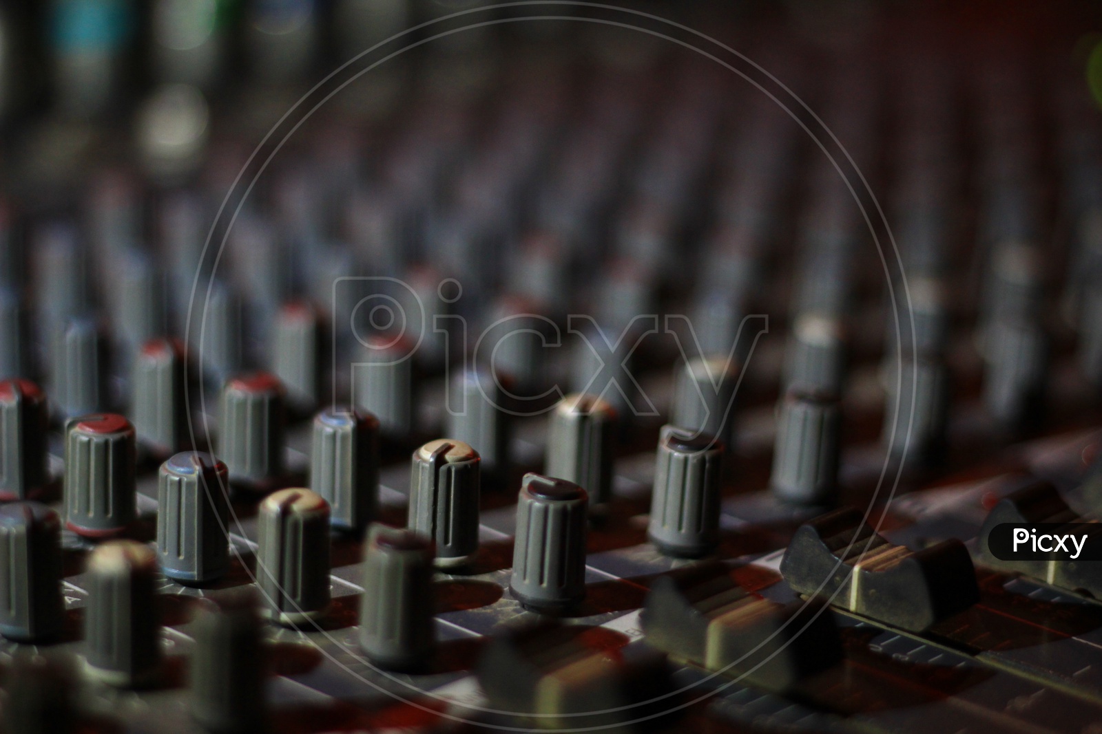 Close Up View Of Knobs And Sliders Of Light And Sound Board Console At A Concert Theater