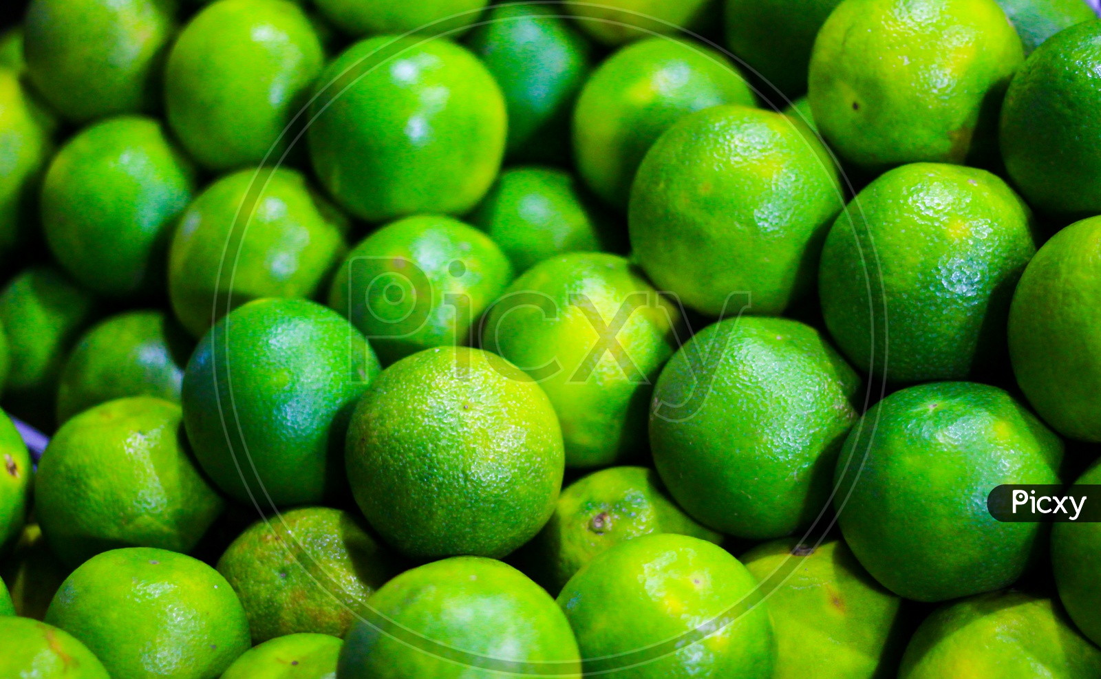 Heap Of Green Sweet Lime For Sale In Market