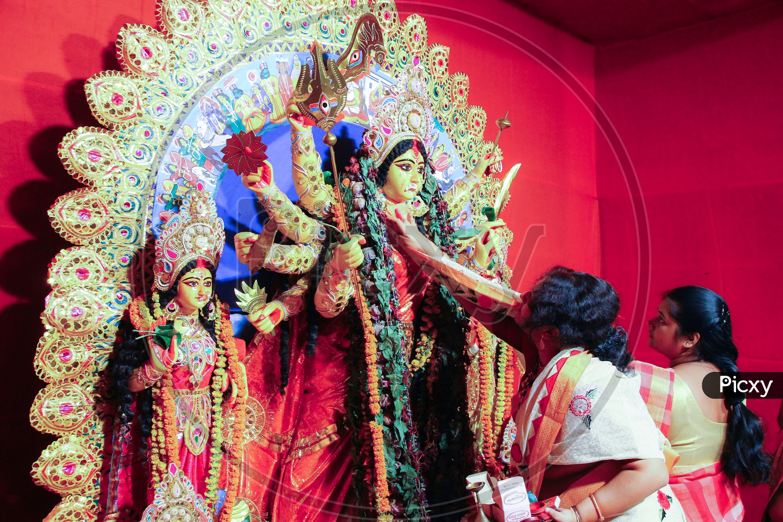 October, 2018, Kolkata, India. Bengali Women Greeting Idol Of Godess Durga With Sweets And Betel Leaves In A Very Important Ritual