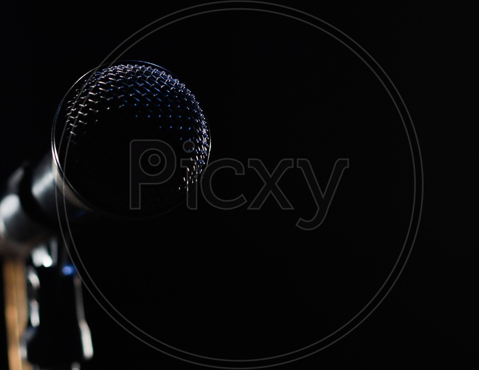 Singing Mic On A Black Background With Space For Text