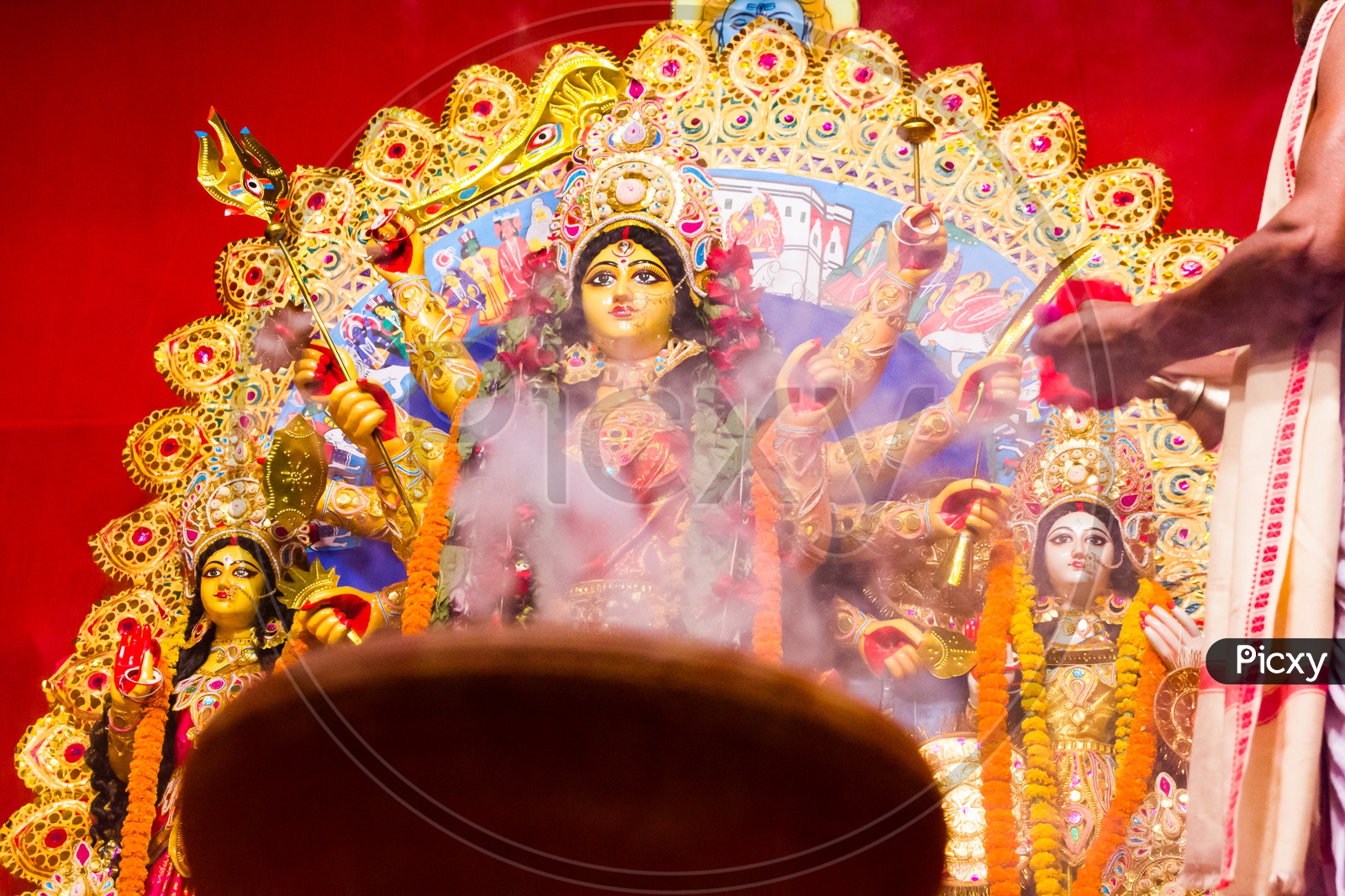 Hazed Picture Of Goddess Durga In Background Of Smoke Of Worship