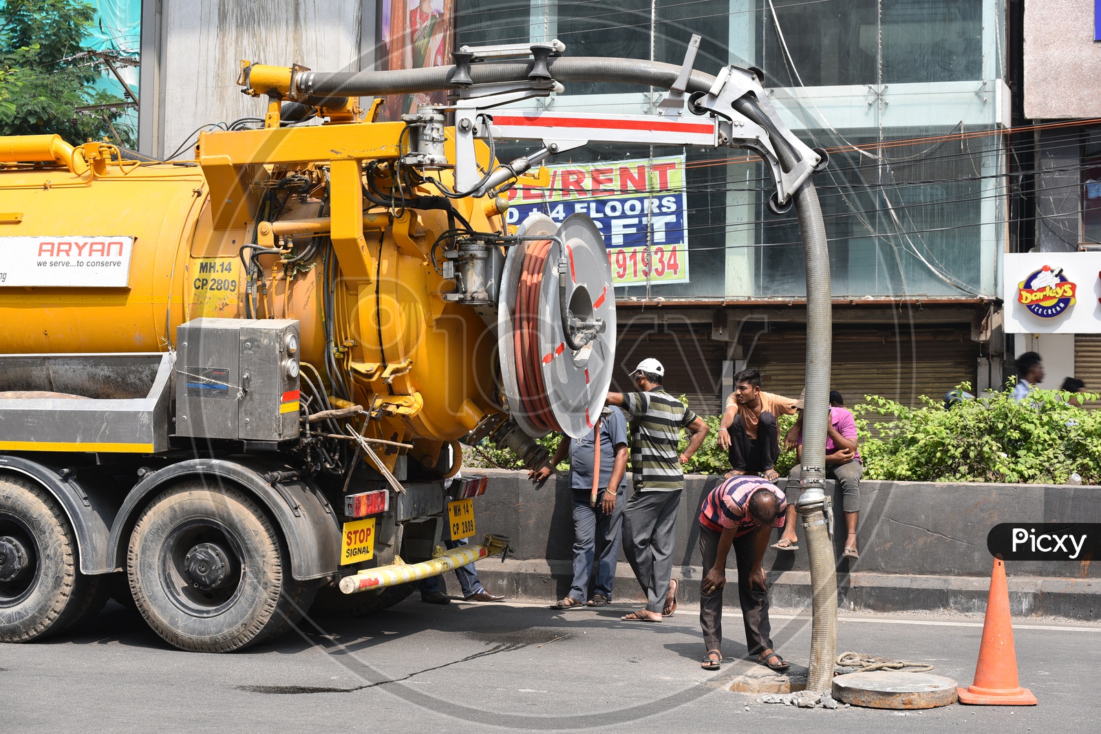 Septic Tank Suction Vehicle Cleaning Sewage From Pot Holes On The Roads of Hyderabad