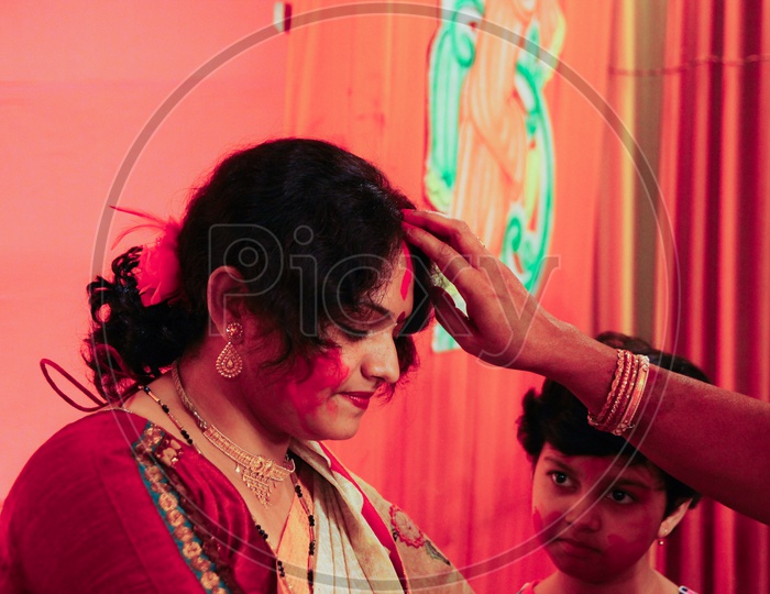 October, 2018, Kolkata, India. A Bengali Wife Playing With Sindur On The Occasion Of Maha Vijaya Dashami, A Common Hindu Ritual