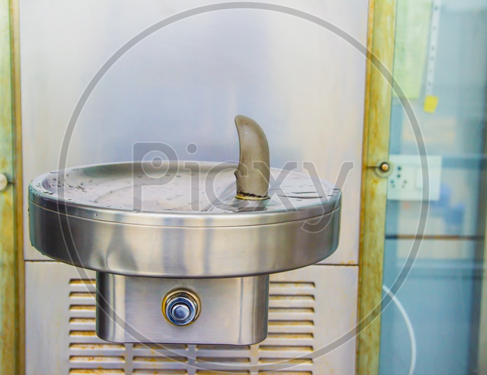 Drinking Water Fountain Outlet In Airport With Water Cooler And Steep Tap And Steel Sink Basin