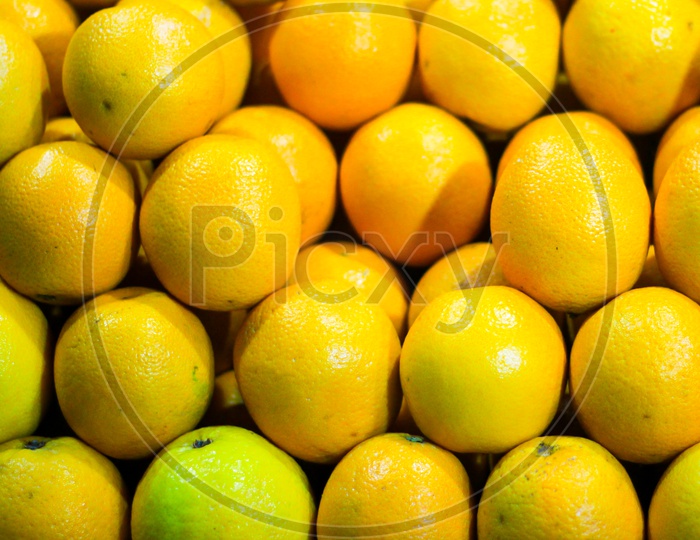 Heap Of Ripe Yellow Sweet Lime For Sale In Market