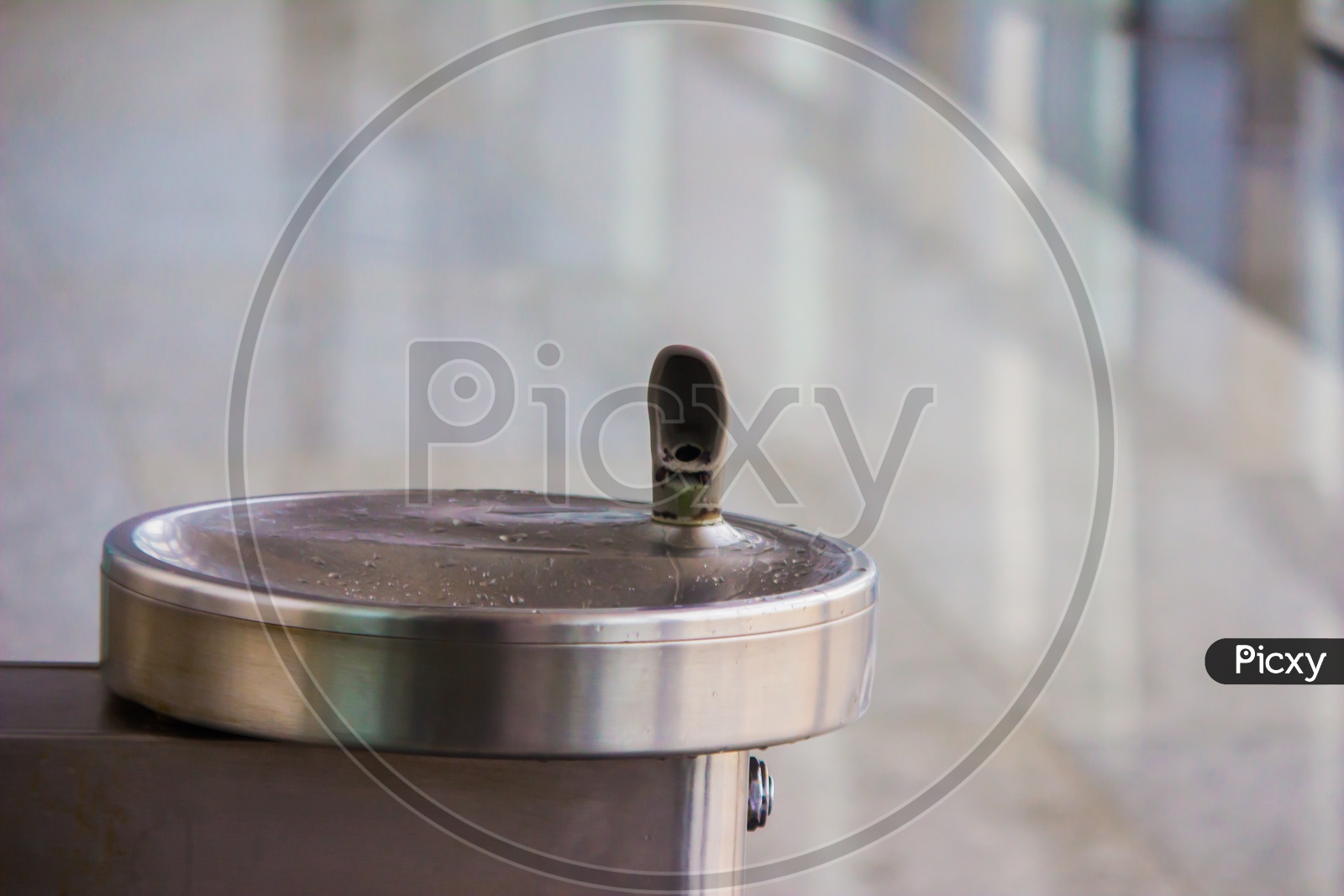Drinking Water Fountain Outlet In Airport With Water Cooler And Steep Tap And Steel Sink Basin