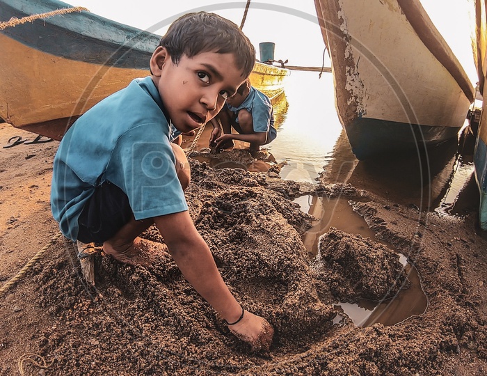 Indian Kids building sand castles