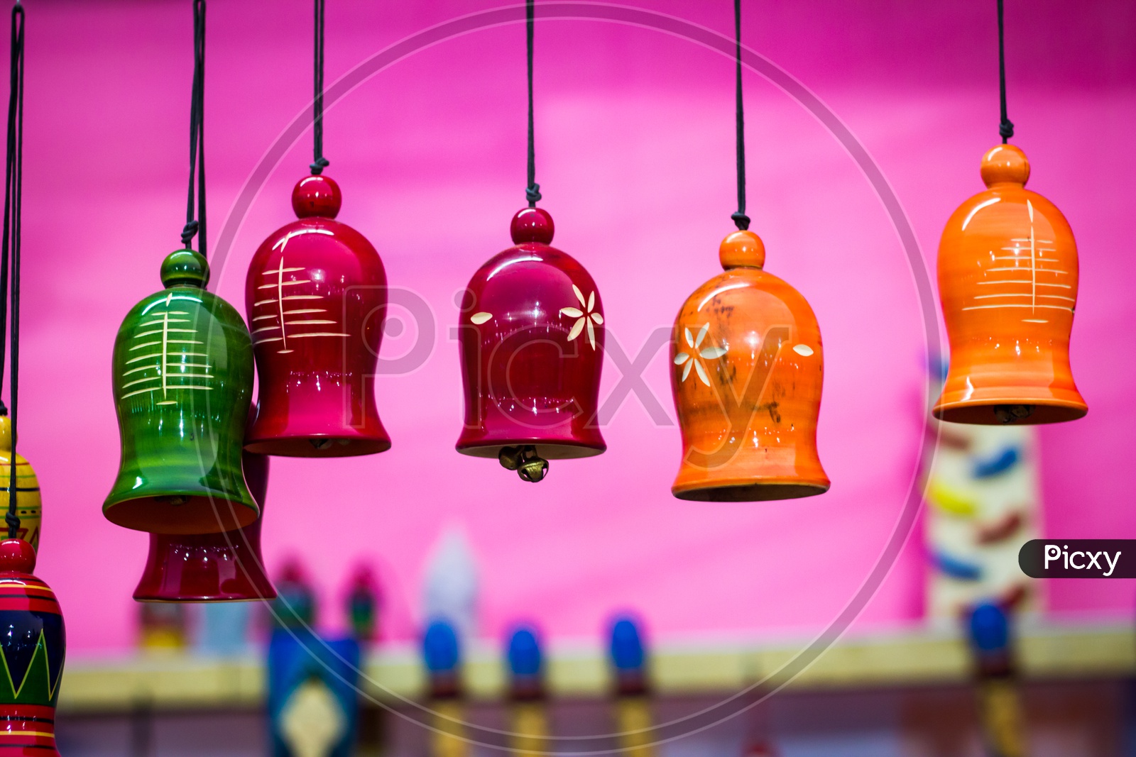 Colorful Wooden Bells Hanging By String. Musical Instrument