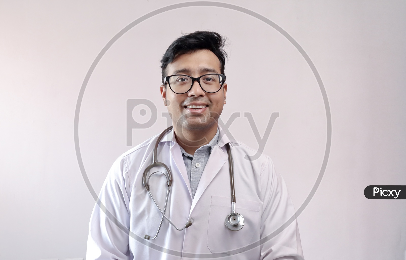 Male Indian Doctor In White Coat And Stethoscope