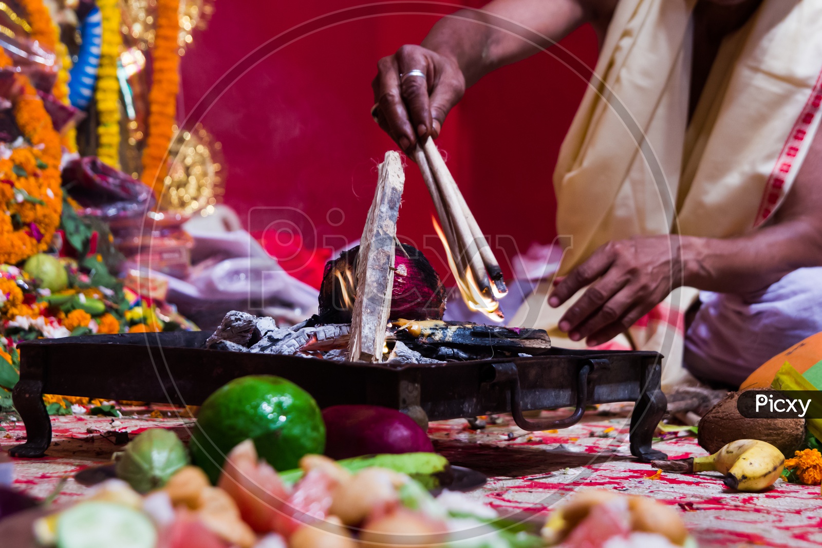 Hand Of A Priest Worshiping Hindu God With Fire And Yagna Ritual