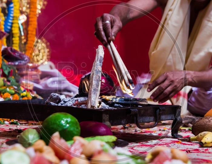Hand Of A Priest Worshiping Hindu God With Fire And Yagna Ritual