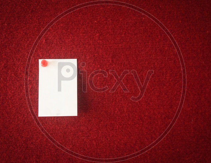 collection of note papers pinned on a red board ready for filling in quotes.