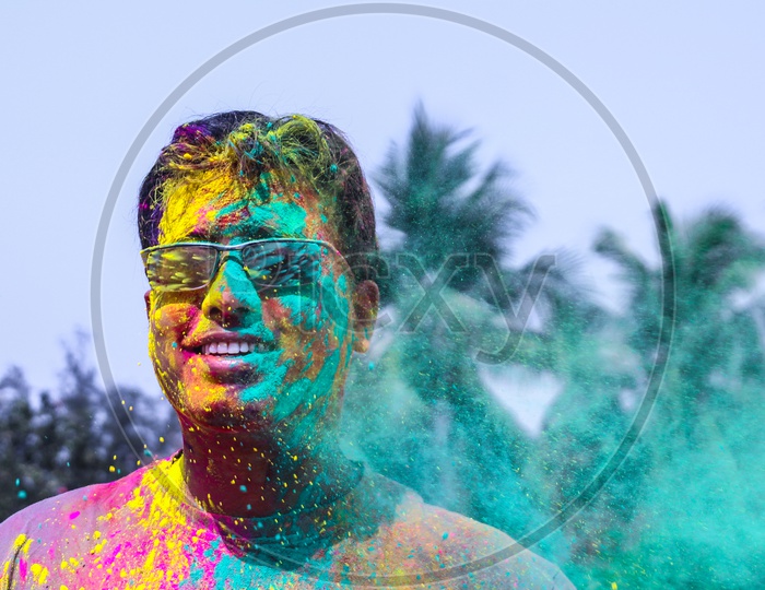 A Man Getting Showered With Holi Colours During Holi Festival In India