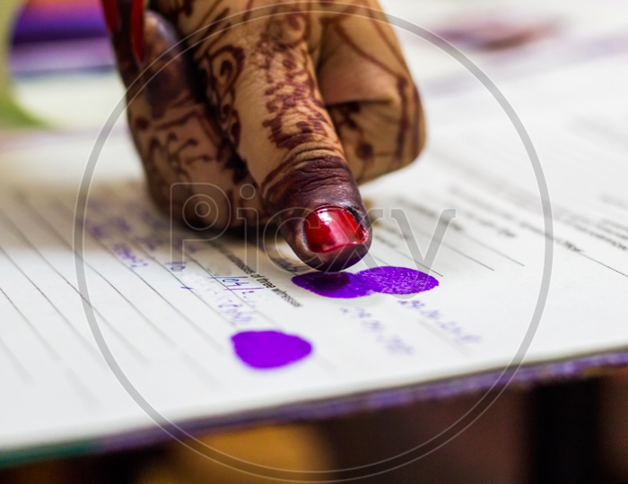Lady Giving Thumb Impression On Marriage Registry Certificate. Indian Matrimony. Bengali Wedding