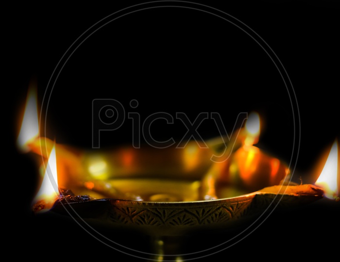 Closeup View Of Oil Brass Lamp Diya For Holy Worship Puja In Black Background