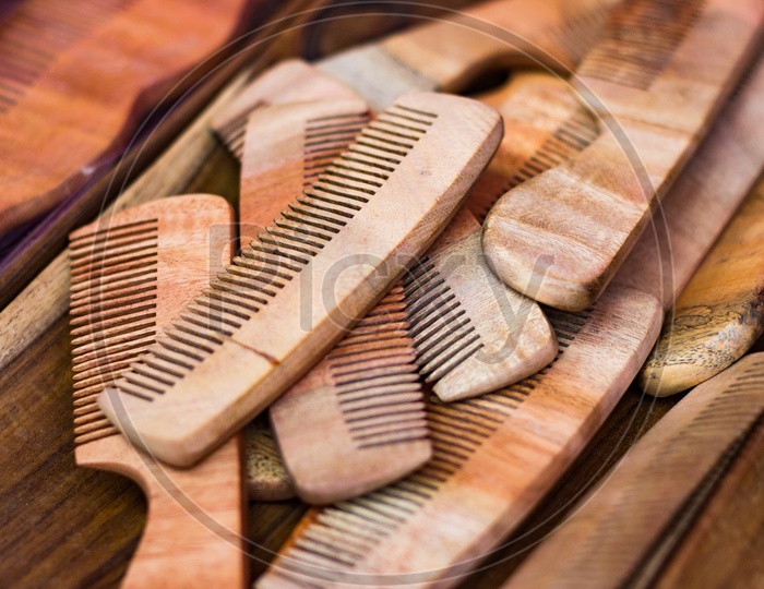 wooden combs on a wooden table. Vintage cosmetic accessory
