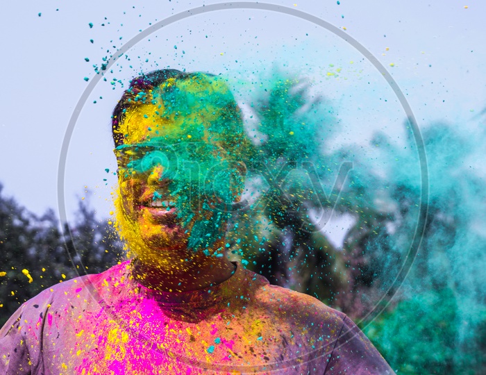 A Man Getting Showered With Holi Colours During Holi Festival In India