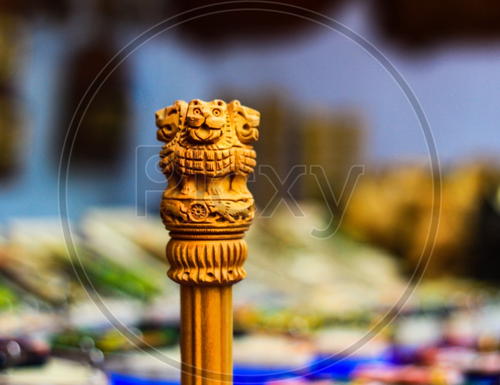 Miniature Wooden Replica Of Ashoka Stambha. An Ancient Historic Indian Monument.Lion Face Pillar Of Ashoka, Indian National Emblem.