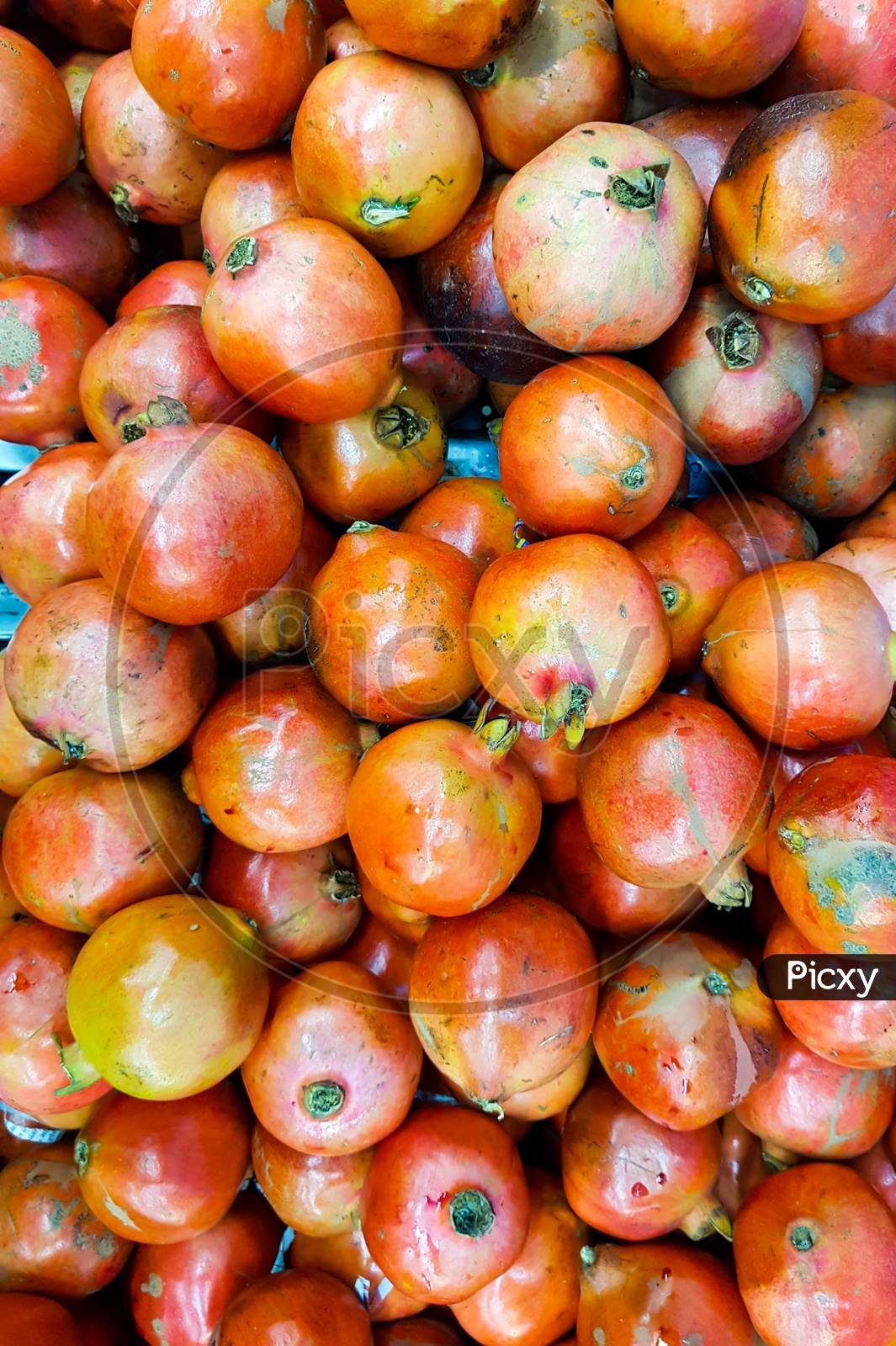 Heap Of Pomegranate For Sale In Market