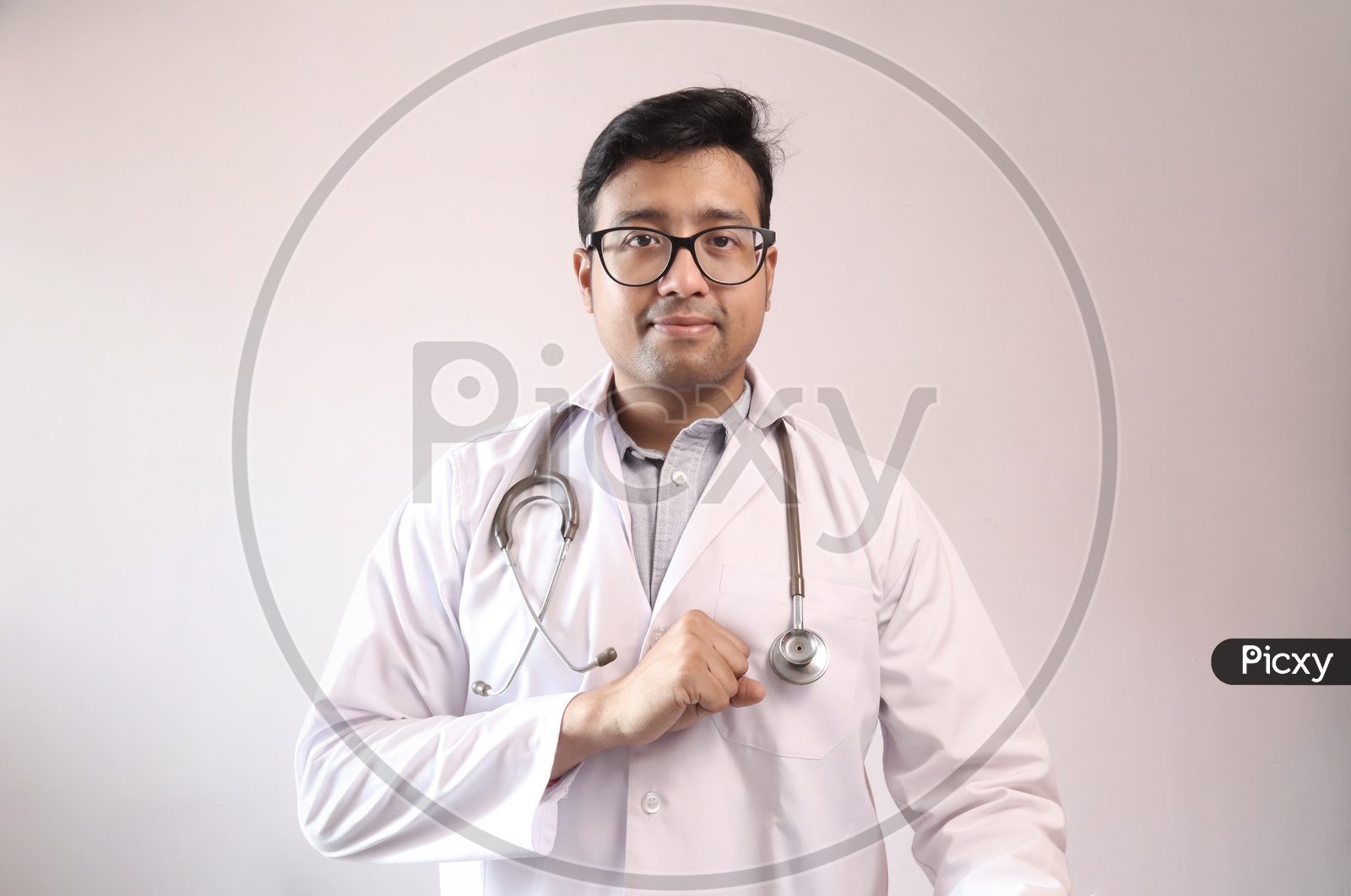 Male Indian Doctor In White Coat And Stethoscope Swearing Hippocratic Oath