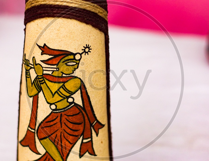 Colourful Figure Of Lord Krishna Drawn On A Vase. Indian God Mythology