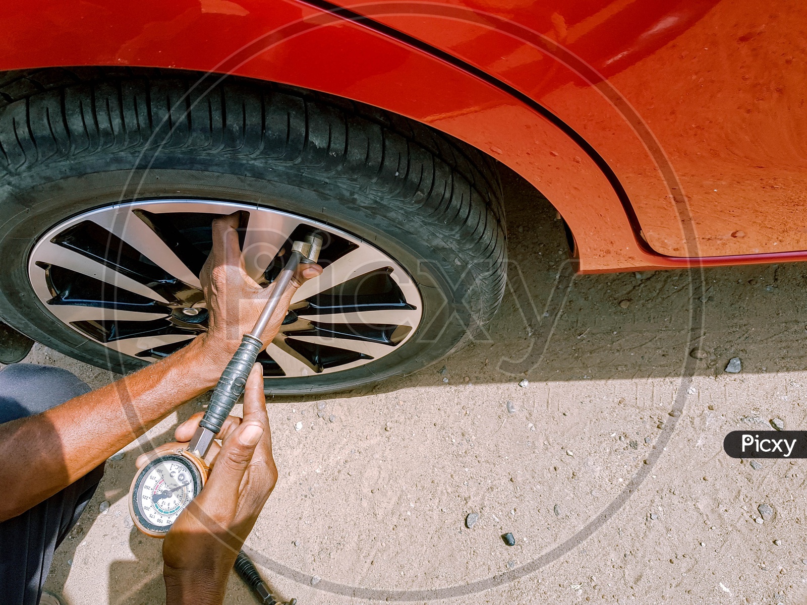 Checking Of Air Pressure With A Manometer In A Rear Tyre Of A Motor Car By Hand Of Mechanic