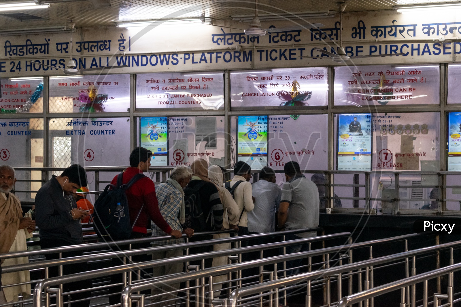 People at the windows for railway ticket booking