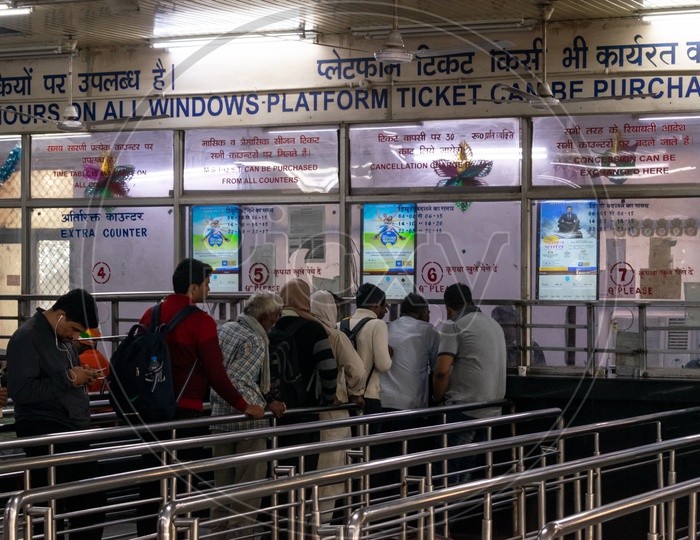 People at the windows for railway ticket booking