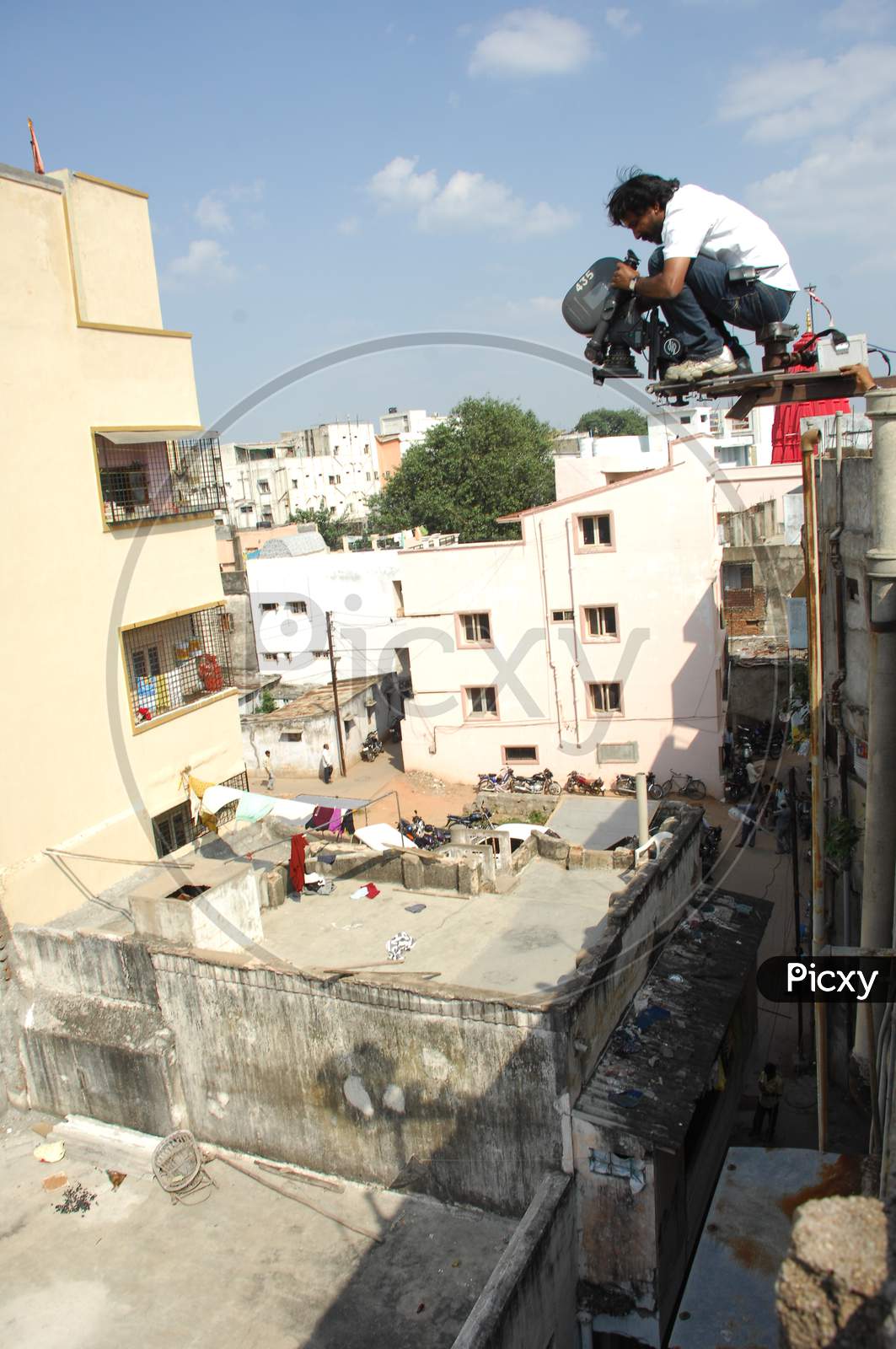 Film Crew Shooting On Top Of a Building