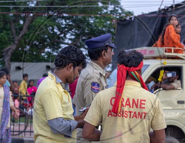 Crane Assistant in Ganesh Vinayaka Idol Nimarjanam Immersion At Tank Bund Hyderabad, 12th September 2019