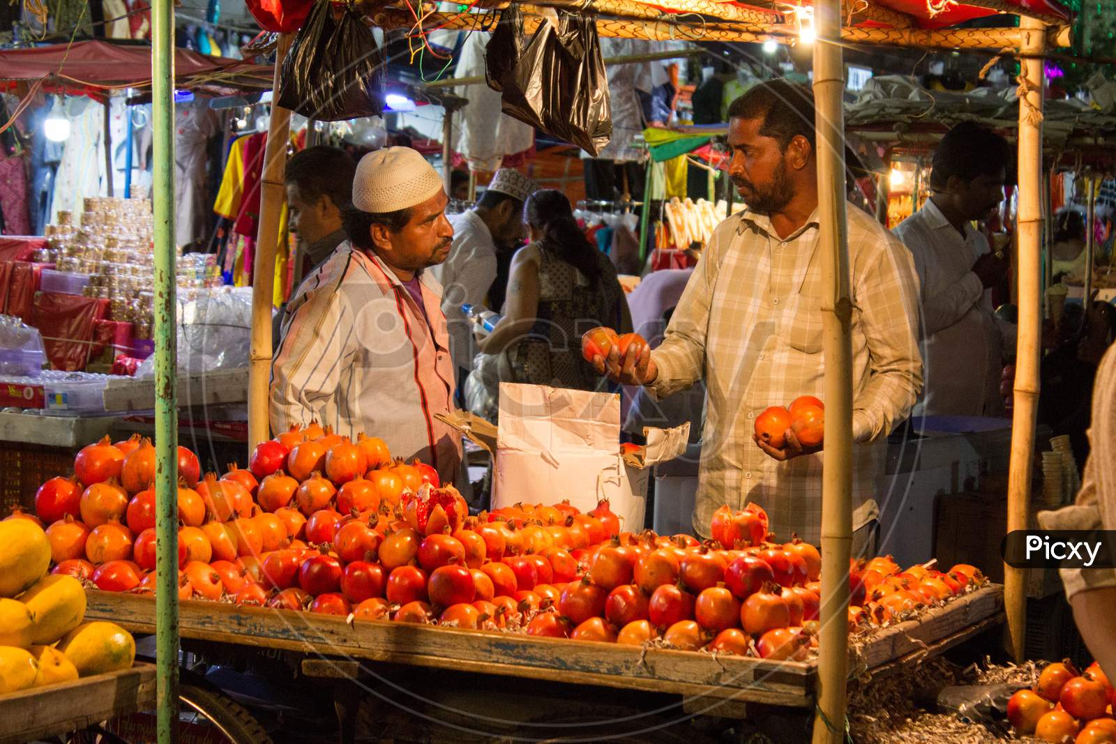 A Fruit Vendor Selling Fruits to People