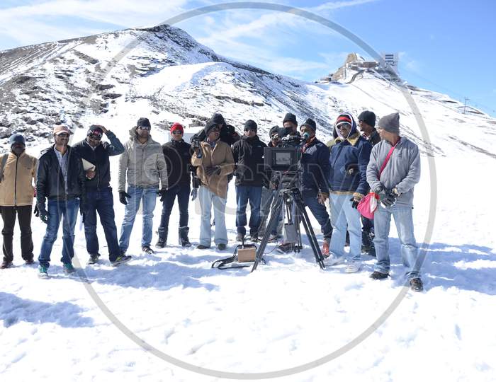 Film Crew Shooting In Snow Filled Mountains