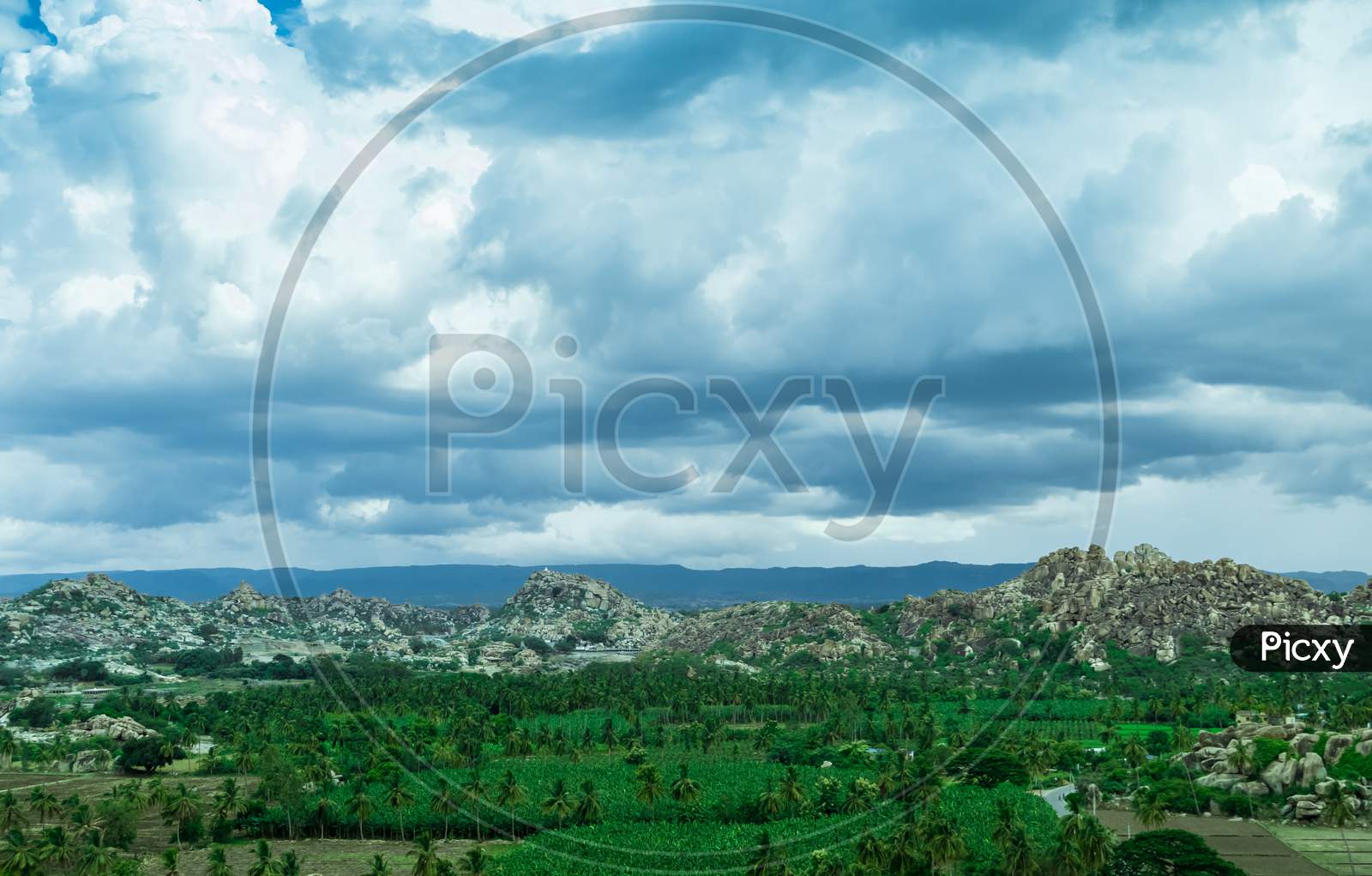 Landscape Of Rock Hills And Greenery   in Hampi