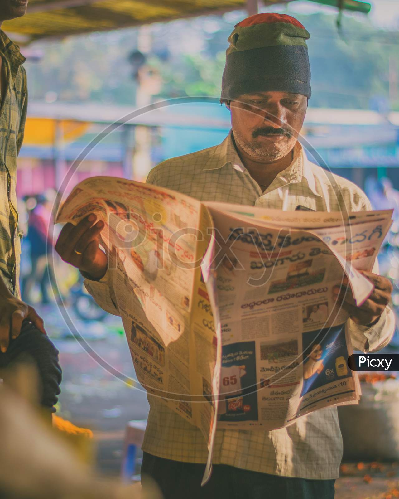 A Man Reading Daily Newspaper