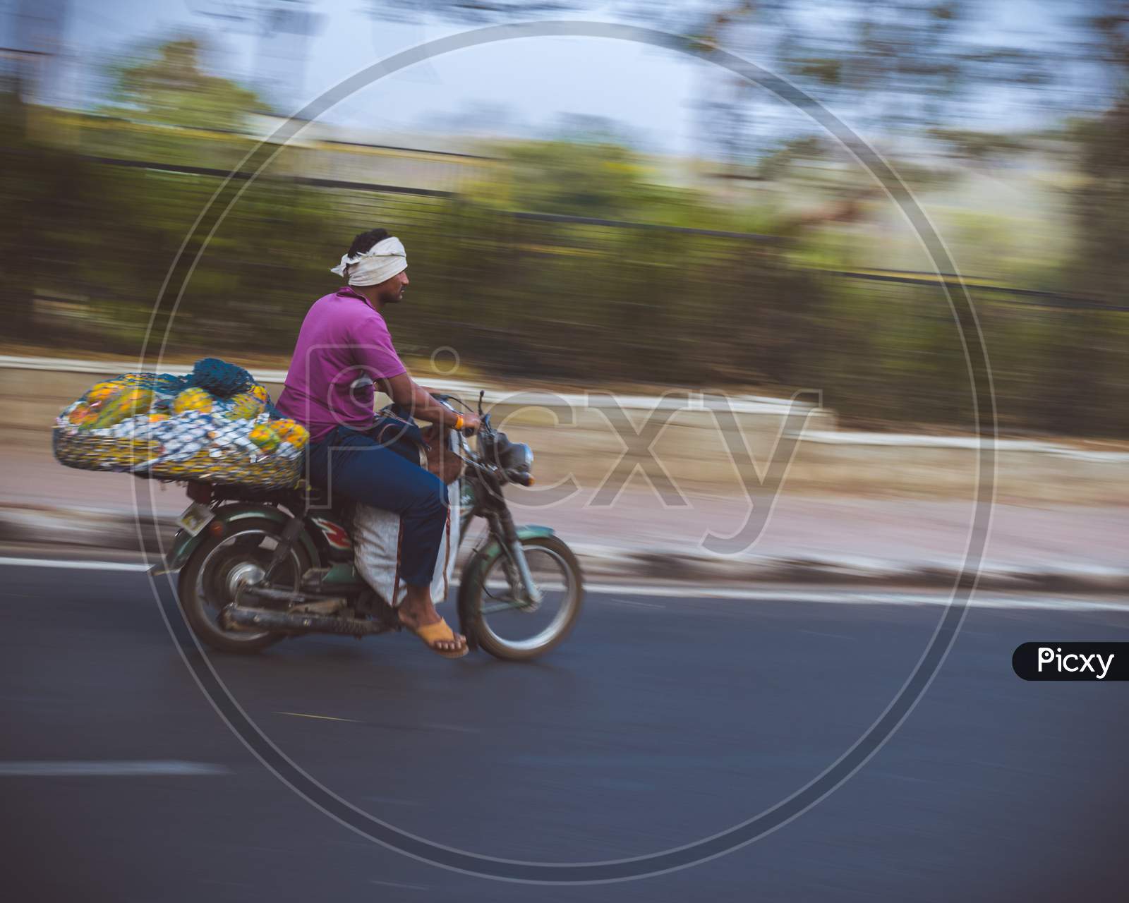 A Fruit Vendor On A Bike