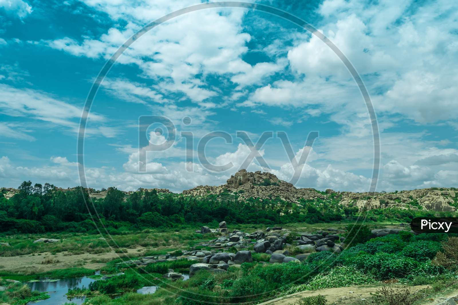 Landscape Of Rock Hills And Greenery   in Hampi