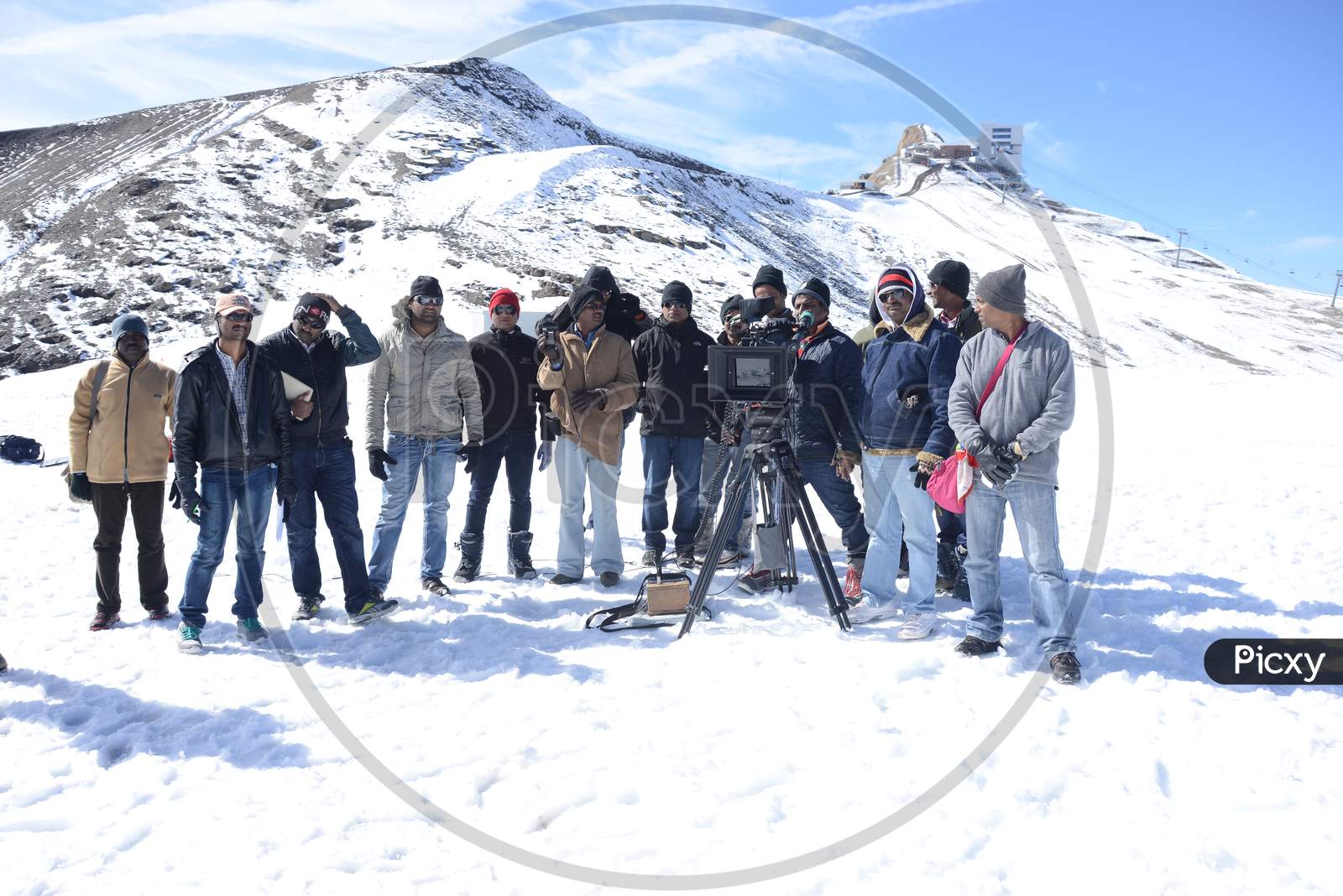 Film Crew Shooting In Snow Filled Mountains