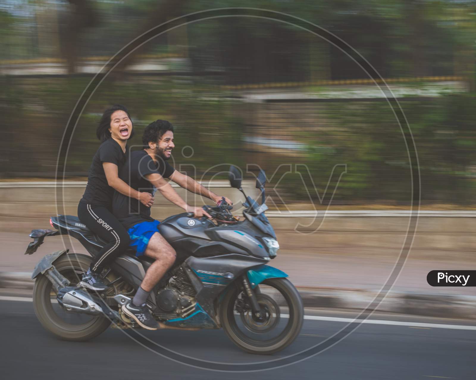 A Happy Couple On a Bike