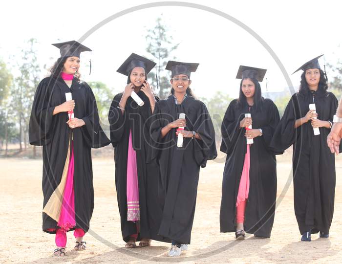 Young Girl Students In Graduation Dress
