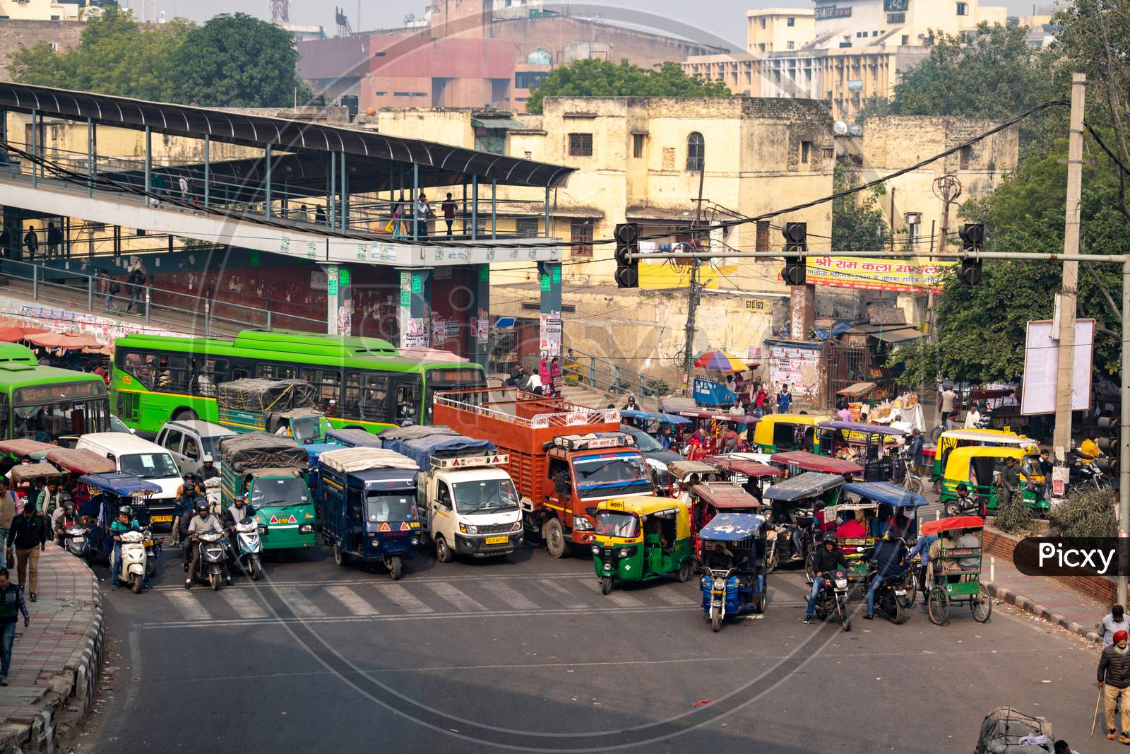Vehicles on a busy road waiting for green signal