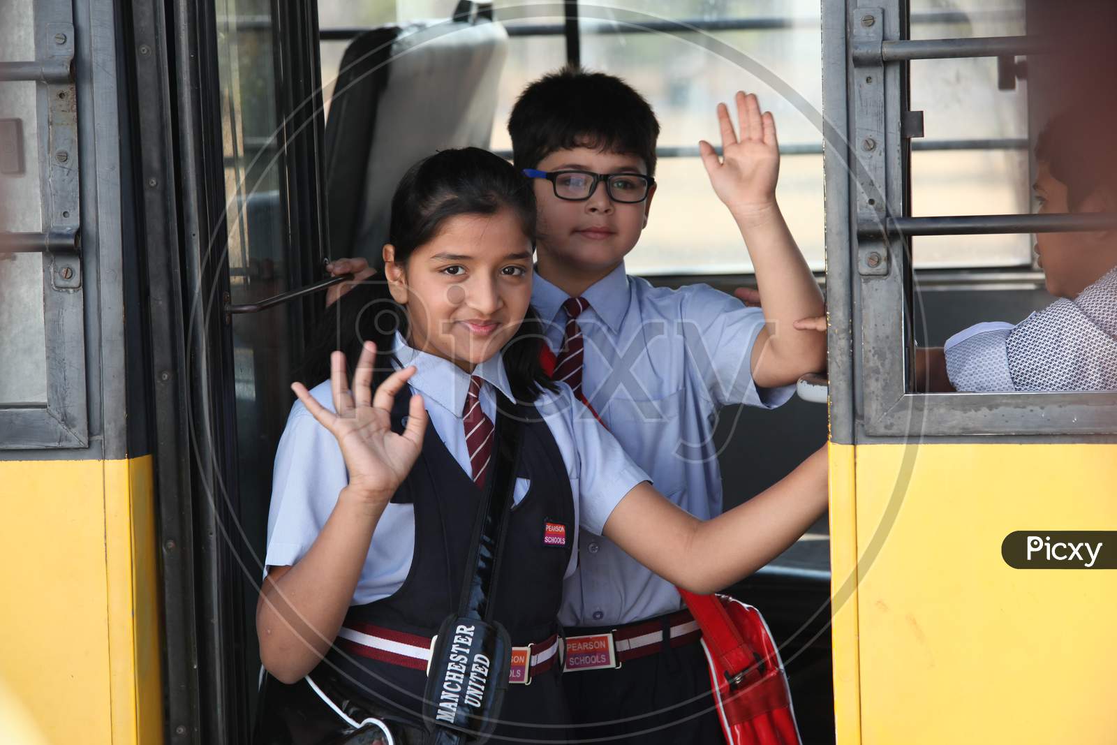 School Students Boarding a School Bus