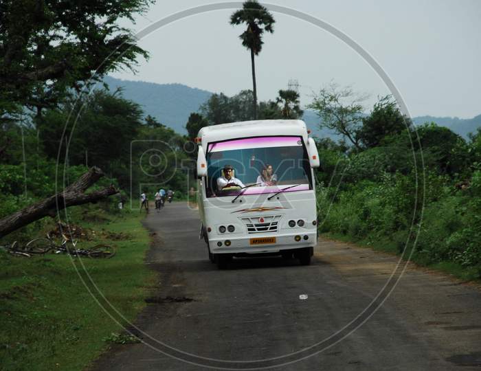 A Bus Moving On Road