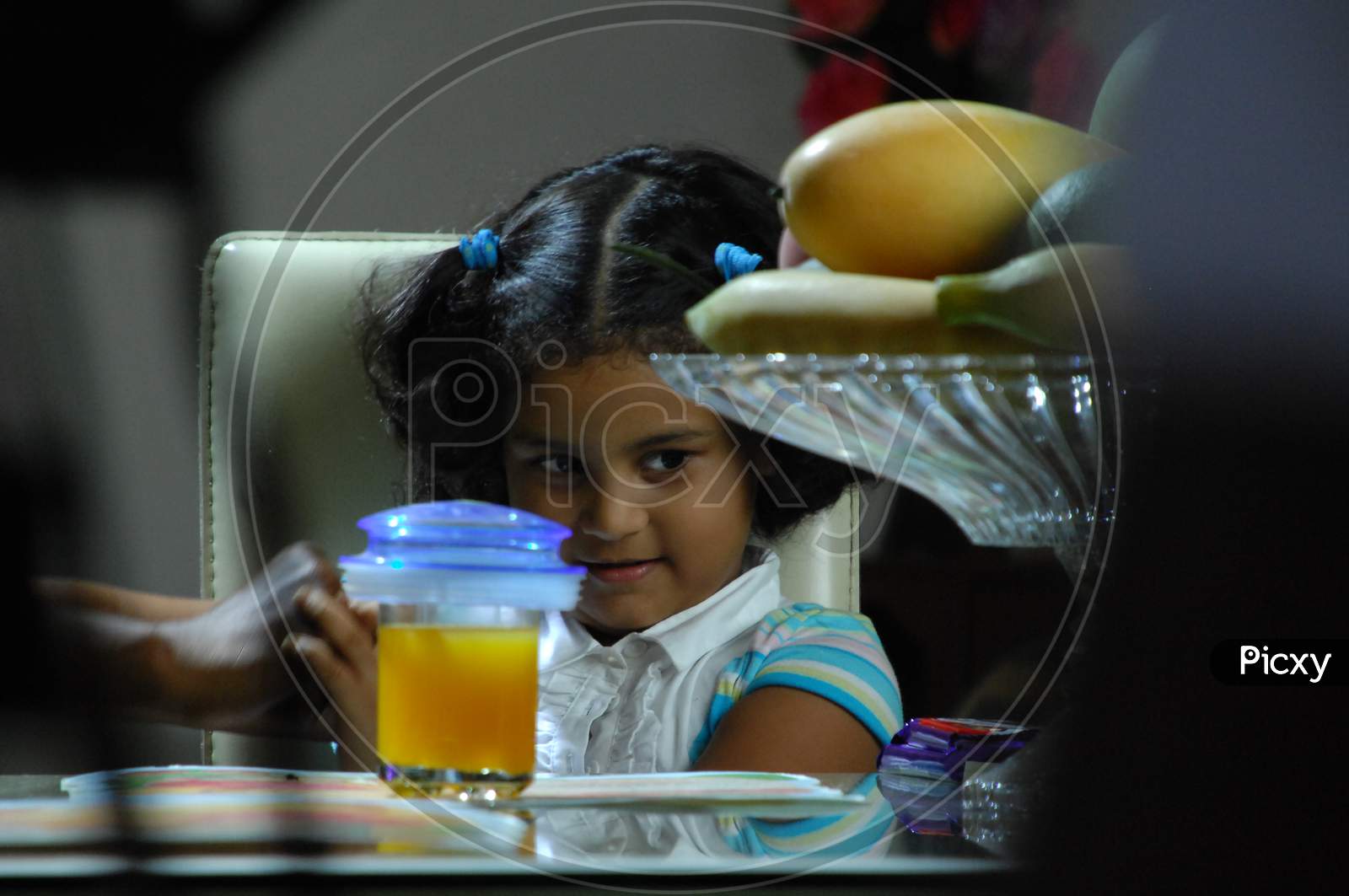 Young Girl Child At a Dining Table